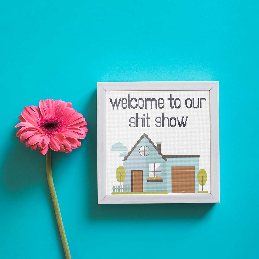 Stitched and framed preview of Welcome Show Counted Cross Stitch Pattern and Kit